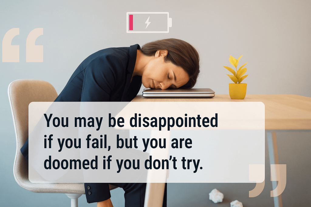 A tired woman in business attire rests her head on a closed laptop at her desk, with a low battery icon above and a motivational quote about perseverance displayed in front.